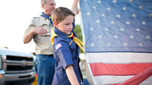 Boy Scout folding American Flag